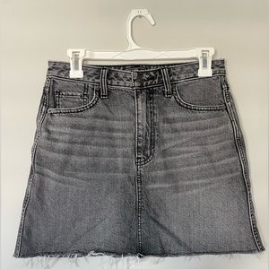 Abercrombie and Fitch black denim skirt. Size 26. Sits mid thigh